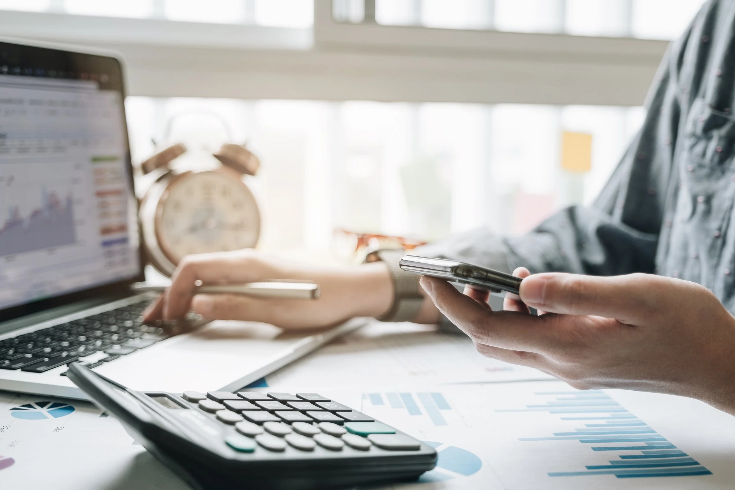 Professional bookkeeper making detailed financial reports
